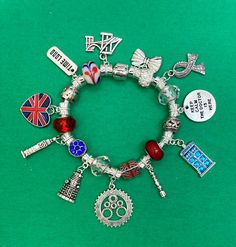 "DR. WHO = \"Time Lord\", TARDIS, \"Keep calm the doctor is here\", DALEK, Big Ben, London bridge, Scarf, bowtie, Union Jack heart, Sonic Screwdriver, Gear Clock along with red, blue, clear, and white beads and crystals.   Bracelet is white \"faux leather\" and is 7.9-8.0 in / 20 cm. My bracelets are a size larger due to the fact that they are \"fully packed\". If you don't know your size, please message me or you can measure your wrist and add 1/2 inch. If different size is needed, please let me know before shipping. These bracelets are handcrafted by ~roseandcharm~. The charms are NOT all sterling silver. These charms are European silver unless stated in descriptions. Any items you question, please ask and I can tell you specifics on your bracelet. These charms are good quality and last Sonic Screwdriver, Gear Clock, Time Lord, Big Ben London, Time Lords, London Bridge, Union Jack, Custom Bracelets, Dr Who