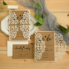 the wedding stationery is laid out on a table