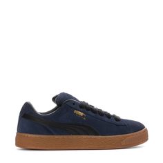 A fresh take on the classic Suedethis PUMA Suede XL is one for the wearing. Featuring an exaggerated padded collar tongue, a chunkier sole, and thick laces, this execution is inspired by the 00s but made for the modern day. A full suede upper plus a leather Formstrip make this classic, durable, and ready for everyday looks.Features: Full suede upper with leather Formstrip. Exaggerated padded collar and tongue. Mesh insole with multiple screen-printed PUMA logo. Thick laces for a throwback look. Adidas Tee, Black And White Sneakers, Puma Logo, Wide Width Shoes, Puma Suede, Backpack Sport, Dress Sandals, Shoe Care, Work Casual