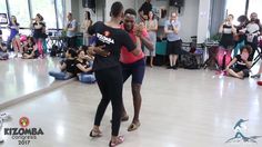 two people dancing in front of an audience at a dance class with one person wearing flip flops