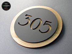 a metal plaque with the number 50 on it