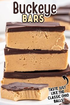 three pieces of peanut butter buckeye bars stacked on top of each other with chocolate in the middle