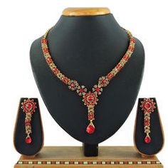 Gold Rodium Polish Red and Maroon color Necklace in Metal Alloy studded with CZ Diamond Red Jeweled Jewelry Sets For Party, Red Stone Work Jewelry Sets For Party, Red Stone Work Jewelry Sets For Gifts, Red Jeweled Jewelry Set For Celebration, Red Jewelry Sets For Festivals, Red Jeweled Kundan Necklace For Celebrations, Red Jeweled Kundan Necklace For Festivals, Festive Red Jeweled Jewelry Sets, Red Traditional Metal Jewelry Sets