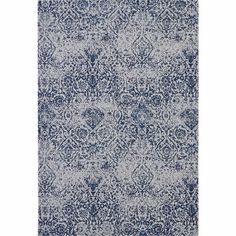 a blue and white rug with an intricate design