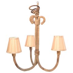 a rope chandelier with two lamps hanging from the bottom and one light on top