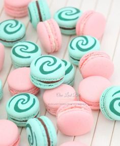 pink and blue macaroons with swirl designs on them