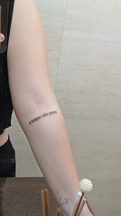 a person with a tattoo on their arm