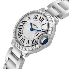 Cartier Ballon Bleu White Gold Diamond Bezel Ladies Watch WE9003Z3. Quartz movement. Caliber 057. Round 18K white gold case 28.0 mm in diameter. Case thickness: 9.35 mm. Fluted crown set with a blue sapphire cabochon. 18K white gold bezel set with original Cartier factory diamonds. Scratch resistant sapphire crystal. Silver sunburst dial with Roman numerals. Blued steel sword shape hands. 18k white gold bracelet with hidden butterfly clasp. Fits 6.5" wrist. Sapphire Cabochon, Cartier Ballon Bleu, White Gold Bracelet, Steel Design, Gold Case, Bezel Diamond, Ladies Watch, Roman Numerals, Sapphire Crystal