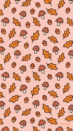 a pink background with orange mushrooms and leaves