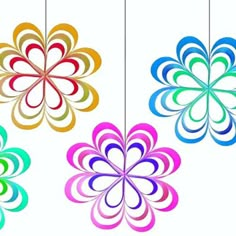 four different colored flowers hanging from strings