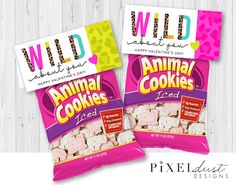 two bags of wild animal cookies on a wooden background with the words happy valentine's day