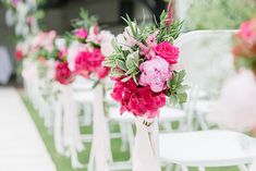 rows of white chairs with pink and red flowers on them