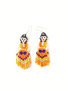 Huichol earrings These handmade beaded earrings are so colorful and lightweight. They are unique and made by the huichol artisans Huichol art and handcrafts are popular worldwide because of the beauty of the jewelry they make and all the art and tradition that the community represents 100% handmade Please notice that due all the light effects, color may vary slightly All orders are shipped using Mexican Postal Service and it takes: 15-25 bussines days (North America). 20-30 bussines days (Europe Handwoven Round Beads Earrings As Gift, Fair Trade Beaded Dangle Earrings, Multicolor Fair Trade Beaded Earrings, Traditional Yellow Handwoven Beaded Earrings, Artisan Orange Beaded Earrings, Traditional Handwoven Multicolor Earrings, Traditional Multicolor Handwoven Earrings, Multicolor Handwoven Earrings Gift, Multicolor Handwoven Earrings For Gift