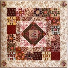 a quilt with many different designs on it