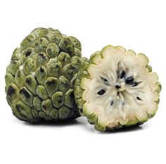 two pieces of fruit are shown next to each other on a white background, one is cut in half and the other has an unripe