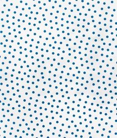 a white and blue polka dot pattern with small dots on the surface, as well as an