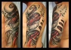 a man's arm and shoulder covered in tattoos, with an abstract design on it