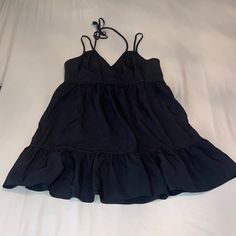 Never Worn Black V-neck Mini Dress For Summer, Lined Black Mini Dress For Beach, Black Mini Sundress For Spring, Black Cotton Vacation Dress, Chic Black Sundress For Spring, Black Cotton Dress For A Day Out, Spring Black Cotton Mini Dress, Black Cotton Mini Dress For Spring, Black V-neck Summer Mini Dress