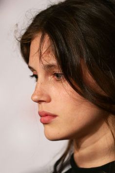 a close up of a person with long hair