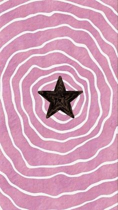 a star in the middle of a pink and white swirl