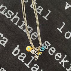 Protect yourself in style with our multi-strand evil eye charm necklace. Made with antique silver chains and 5 staggered evil eye charms, this bracelet is a playful and unique addition to any outfit. Ward off bad vibes and look good doing it! Eyes of Protection, 5 Evil Eye Charms, Multi Strand Necklace Evil Eye Charms Feature CZ Stones of the Highest Quality and Faux Turquoise accented with Silver, Bronze, and Gold 16" Antique Silver Curb Chain Fashion Jewelry Made in the U.S.A. (see artist info Trendy Evil Eye Jewelry For Festivals, Bohemian Style Charm Necklaces With Adjustable Chain For Layering, Trendy Silver Multi-strand Charm Necklaces, Everyday Evil Eye Charm Necklaces, Affordable Round Evil Eye Charm Necklaces, Evil Eye Pendant Charm Necklace For Everyday, Everyday Evil Eye Pendant Charm Necklace, Bohemian Sterling Silver Charm Necklace, Evil Eye Pendant Charm Necklace