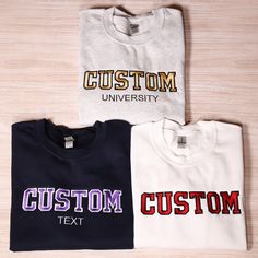 Custom Text Embroidered Sweatshirt, Personalized University Embroidery Hoodie, Custom Varsity Outfit, Customized Women Clothing, Custom Gift Looking for a distinctive personalized sweatshirt? These embroidered sweatshirts offer a wonderful option for various occasions such as anniversaries, gifts for your significant other, or as a keepsake for a special milestone in your relationship. To Place Your Order: Begin by selecting your preferred sweatshirt color. Then, choose the size that fits you be Varsity Sweatshirt With Letter Embroidery For College, Cotton Hoodie With Embroidered Graphics For College, College Hoodie With Embroidered Text For Fall, College Hoodie With Letter Embroidery And Long Sleeves, Varsity Sweatshirt With Custom Embroidery For Streetwear, Embroidered Hooded Sweatshirt For College, Varsity Hoodie With Letter Embroidery For College, College Fall Hoodie With Embroidered Text, Embroidered Crew Neck Sweatshirt For College