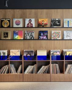 the shelves are filled with records and cds