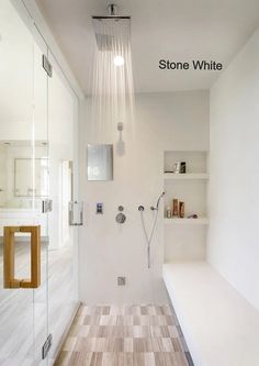 a bathroom with a shower head and wooden floor