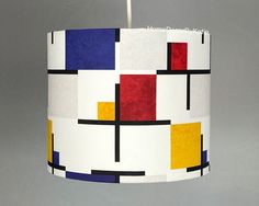 a colorful lamp shade hanging from a ceiling