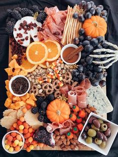 a table topped with lots of different types of food and snacks on top of it