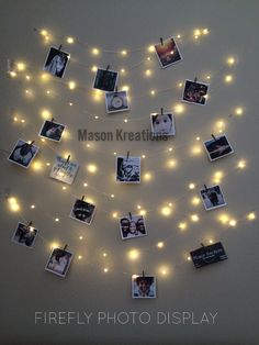 a string of lights with pictures hanging from it's sides and photos on them