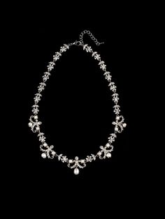 Victorian style crystal rhinestone and pearl charm necklace. Curb chain with lobster claw closure. The filigree is plated in rhodium. Measurement is a total length of 18.0 inches. Handmade in USA. Formal Silver Rhinestone Pearl Necklace, Silver Rhinestone Necklace With Pearl Chain, Formal Silver Rhinestone Necklace With Pearls, Formal Silver Pearl Rhinestone Necklace, Silver Pearl Rhinestone Necklace For Formal Occasions, Elegant Silver Rhinestone And Pearl Necklace, Silver Crystal Pearl Necklace With Rhinestones, Silver Bridal Necklace With Pearl Chain And Crystal, Crystal Jewelry With Lobster Clasp For Wedding