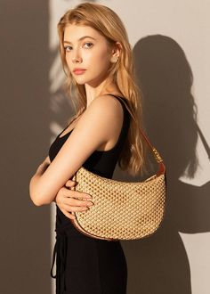 Indulge in luxury with our Woven Raffia Saddle Bag, expertly crafted with a blend of raffia and leather. Its adjustable shoulder strap ensures a perfect fit for women of all sizes. Elevate your style with this exclusive and elegant addition to your wardrobe. Size info 10 5/8" (27cm) width 6 3/4"(17cm) height 3"(8cm) depth Details Raffia and genuine cowhide leather Polyester lining Adjustable shoulder strap Interior wall pocket and zipper pocket Top zip closure Item #462501 Women's saddle shoulde Natural Color Hobo Shoulder Bag With Detachable Strap, Natural Hobo Shoulder Bag With Detachable Strap, Brown Crossbody Shoulder Bag With Bamboo Handle, Chic Satchel Straw Bag With Detachable Strap, Elegant Straw Tote Bag With Detachable Strap, Luxury Summer Shoulder Bag With Detachable Strap, Elegant Satchel Straw Bag, Chic Straw Satchel Bag With Detachable Strap, Luxury Straw Shoulder Bag In Rectangular Shape