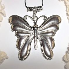 Silver Butterfly Necklace, Statement Necklace, Pendant, Butterfly, Necklace A143 This Extra Large Butterfly Necklace Is Sure To Get You Lots Of Compliments. Brand New Nwt And Handmade By Me - Wvluckygirl. Hand Crafted With An Antiqued Silver Toned Costume Jewelry Butterfly Charm. If You Look At The Bail On Top There Is A Lovely Floral Design. The Pendant And Bail Measure 2 3/4 Inches Tall And 2 3/4 Inch Wide. Very Big And Heavy. A Great Statement Piece. Comes With A 36 Inch Black Nylon Rope Cord Silver Metal Necklace With Butterfly Charm, Silver Metal Butterfly Jewelry, Silver Butterfly Metal Jewelry, Silver Necklace With Butterfly Charm, Adjustable Silver Butterfly Pendant Necklace, Silver Adjustable Butterfly Pendant Necklace, Nickel-free Silver Charm Necklace, Silver Pewter Jewelry Gift, Silver Butterfly Charm Jewelry