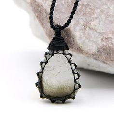 Beautiful handmade macrame-wrapped Tourmalated Quartz pendant, with an adjustable black necklace cord. Tourmalated Quartz is known as a powerful crystal that combines and amplifies the properties of Tourmaline and Clear Quartz Crystal. It is believed to offer physical protection acts as a negativity shield, and brings to the wearer's life luck, grounding, and balancing energy. This necklace can be a perfect meaningful gift for your loved one or yourself! ►►This is a one-of-a-kind necklace, you w Black Crystal Necklace With Adjustable Cord, Black Jewelry With Adjustable Cord For Healing, Hand Wrapped Black Jewelry With Waxed Cord, Black Pendant Jewelry With Waxed Cord, Spiritual Black Crystal Necklace With Adjustable Cord, Black Waxed Cord Pendant Jewelry, Black Pendant Necklace With Waxed Cord, Black Pendant Necklace On Waxed Cord, Macrame Crystal Necklace