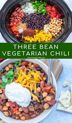 three bean vegetarian chili in a black crock pot with cheese and sour cream on top