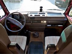 the interior of an old car with leather seats