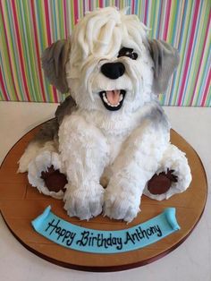 a cake shaped like a dog sitting on top of a table