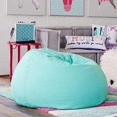 a large bean bag chair sitting on top of a rug