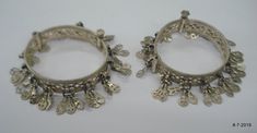 "Vintage Antique ethnic collectible very nice tribal old silver charm Bracelet or bangle pair from Rajasthan India. Worn by Banjara tribal people of Rajasthan. Beautiful workmanship all over the piece, adorn with silver charms. One quarter-hinged part can be open by pin. Original old pair in good condition with great antique look. great pair for jeweley collection. Inner diameter across - 5.3 cm(2\") Inner circumference -16.6 cm (6.5\") width include charms - 2.6 cm(1\") weight for pair - 92.5 g Nickel-free Traditional Bangle Jewelry, Traditional Metal Anklets Handmade, Traditional Handmade Metal Anklets, Ornate Handmade Metal Bangle, Handmade Ornate Metal Bangle, Traditional Nickel-free Bracelet Jewelry, Festival Silver Beads Bangle Jewelry, Traditional Metal Bracelets For Festivals, Ornate Handmade Bangle In Antique Silver