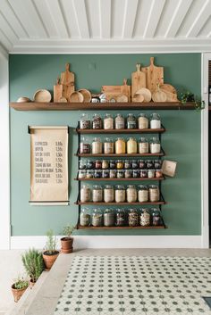 the shelves are filled with jars and spices