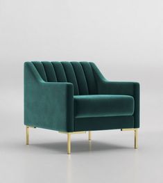 a blue couch sitting on top of a white floor next to a wooden leg chair