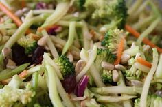 broccoli, carrots, and other vegetables are mixed together in a salad