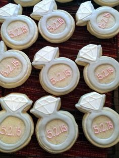 decorated cookies with white frosting and pink icing