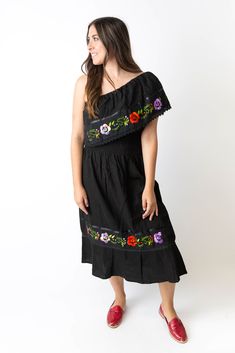 Mexican Pueblo One Shoulder Dress - Black  Mexican Pueblo One Shoulder Dresses are ideal for any occasion and will definitely make a fashion statement at the next Fiesta!  Please note that each dress is individually embroidered so the embroidery design will vary from the one pictured. You will receive the dress color selected.  This is a ONE SIZE FITS Small through Large  Length: Approx: 38" inches Traditional Black Spring Dresses, Black Peasant Dress For Summer, Black Folk Embroidered Summer Dress, Black Cotton Folk Dress, Black Folk Style Cotton Dress, Black Peasant Dresses, Black Peasant Dress For Spring, Black Cotton Folk Embroidered Dress, Black Folk Dress With Floral Embroidery