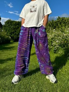 Elevate Your Festival Wardrobe with These Stunning Unisex Tie-Dye Hippie Trousers! Designed for ultimate comfort and style, these unisex Hippie Trousers are the perfect addition to your festival wardrobe and everyday look. Crafted from sustainable, eco-friendly cotton, these trousers are ideal for those who value both fashion and the environment. Whether you're dancing at a festival, flowing through yoga, or simply embracing your free-spirited lifestyle, these trousers will keep you feeling and Hippie Cotton Harem Pants For Meditation, Cotton Hippie Harem Pants For Meditation, Casual Harem Pants For Festivals, Casual Festival Harem Pants, Hippie Cotton Harem Yoga Pants, Casual Harem Yoga Pants For Festival, Bohemian Cotton Parachute Pants For Yoga, Baggy Yoga Pants For Summer Festival, Relaxed Fit Harem Pants For Summer Festivals