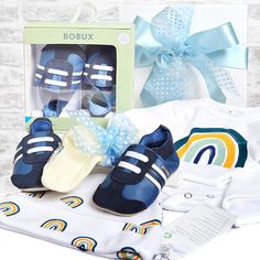 The perfect layette gift box for a newborn baby boy! This Organic Cotton Baby Boy Layette gift box includes a 100% organic cotton Rainbow Bodysuit, an organic cotton Rainbow Hat, a pair of NZ Bobux soft sole leather sports classic baby shoes and NZ made Merino Wool Baby Socks. The organic cotton baby clothing is ideal for a delicate new baby and meets the Global Organic Textile Standard. Bobux leather baby shoes are designed in New Zealand and come recommended by podiatrists and paediatricians.