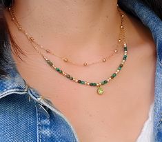 This double row necklace is delicately made with high quality malachite stones, and a zirconium pendant which adds charm to the necklace. Ideal for bringing an elegant and chic style to all your outfits, it is perfect for a gift for someone or for yourself (-: - Details - . Materials: - Gold stainless steel chain - 3mm faceted malachite - 6mm green zirconium pendant - Gold plated beads . Necklace length 1st row satellite chain: 38cm 2nd row chain: 40cm +5cm adjustable chain. . The chain and the lobster clasp allow the necklace to be perfectly adjusted to the size of the neck (possibility of modifying the length of the necklace on request) . The necklace is sent (by registered letter) with an organza bag. If you mark the order as a gift, I will put the necklace in a gift bag closed with a s Green Bead Necklace, Malachite Necklace, Green Beaded Necklace, Malachite Stone, Necklace Green, Necklace Minimalist, Moonstone Necklace, Pendant Gold, Multi Strand Necklace