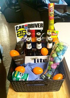 a basket filled with drinks and snacks on top of a table