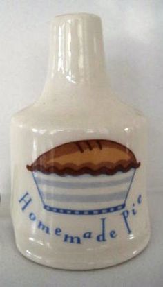 a white ceramic bottle with a blue and white striped design on it that says homemade pie